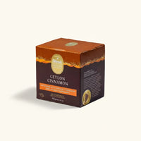 Box of Dilmah Ceylon Cinnamon tea on a beige background